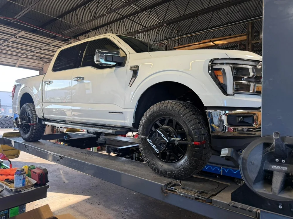 White pickup truck on the alignment rack at Jupiter Car-Care in Jupiter