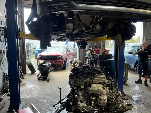 Engine removed from a vehicle on the shop floor at Jupiter Car-Care in Jupiter